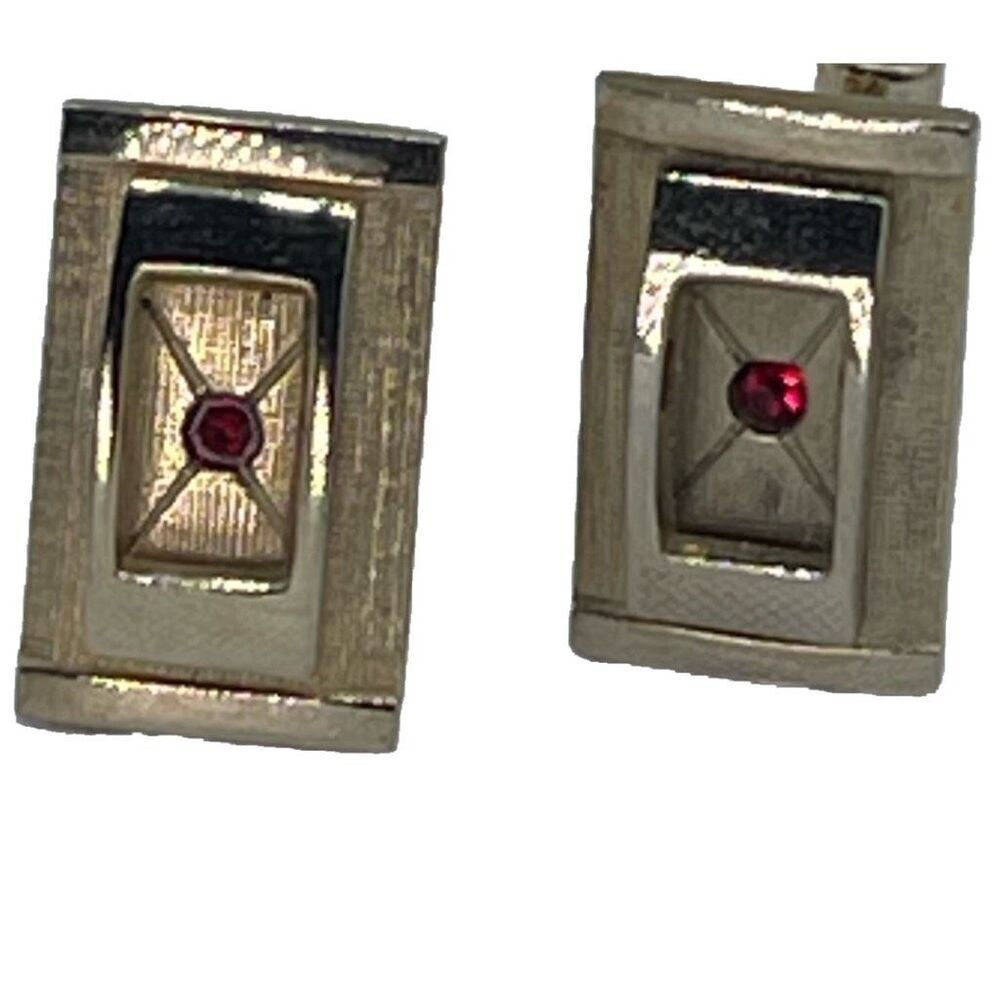 Vintage gold tone cufflinks with cut red glass crystals